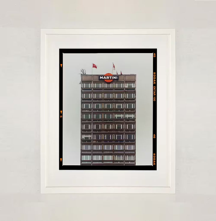 A white framed limited edition photograph by Richard Heeps using vibrant colours, the title is Grey Martini (Film Rebate) Milan, 2019