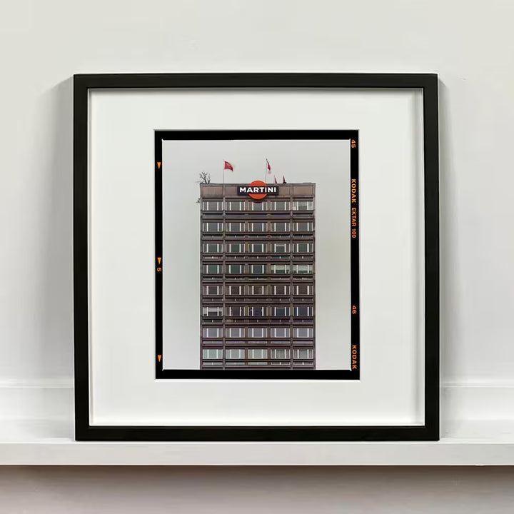 A framed limited edition photograph by Richard Heeps using vibrant colours, the title is Grey Martini (Film Rebate) Milan, 2019