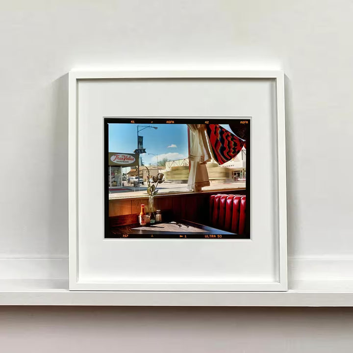 A framed limited edition photograph by Richard Heeps using vibrant colours, the title is Bonzanza Cafe (6x7 Film Rebate), Lone Pine, California, 2001 