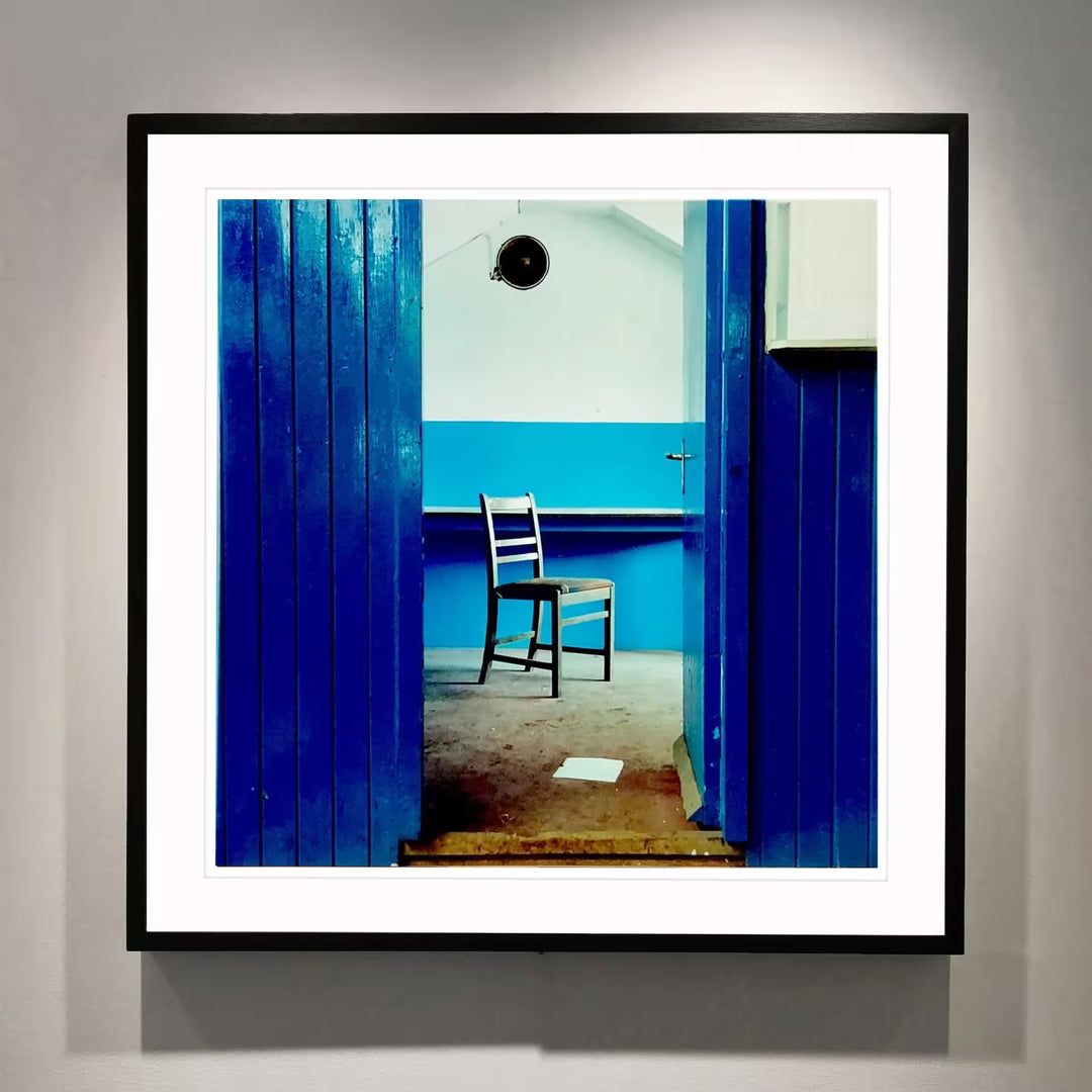 A framed limited edition photograph by Richard Heeps using vibrant colours, the title is Chair, Northwich, 1986