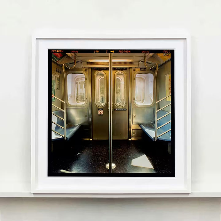 A white framed limited edition photograph by Richard Heeps using vibrant colours, the title is New York City Subway Car, NYC, 2013