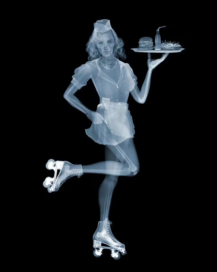 A limited edition Chromaluxe print by Nick Veasey of an X-Rayed waitress on roller skates, the title is Roller Waitress