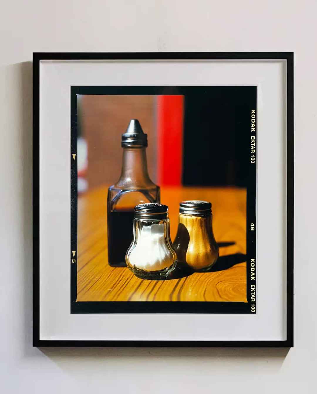 A framed limited edition photograph by Richard Heeps using vibrant colours, the title is Salt, Pepper, and Vinegar, Clacton-On-Sea, 2021