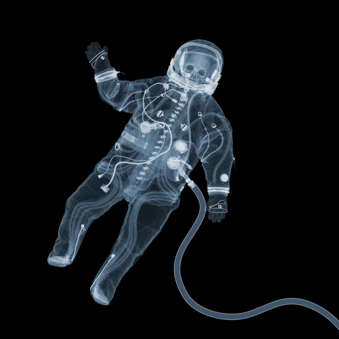 A limited edition Chromaluxe print by Nick Veasey of an X-Rayed Spaceman waving, the title is Say Hello, Wave Goodbye