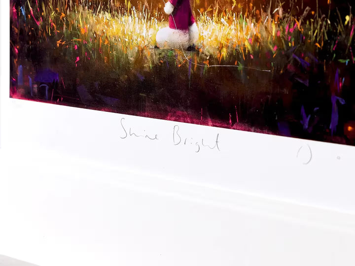 A Doug Hyde limited edition of a person holding a glowing gold balloon, the title is Shine Bright