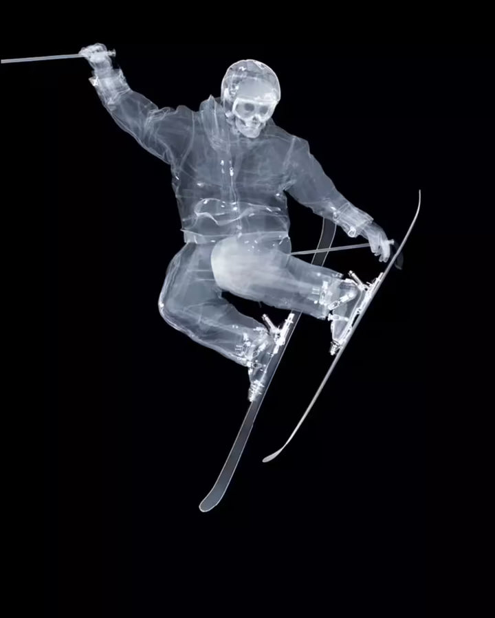A limited edition Chromaluxe print by Nick Veasey of an X-Rayed Skier doing a trick mid air, the title is Skier