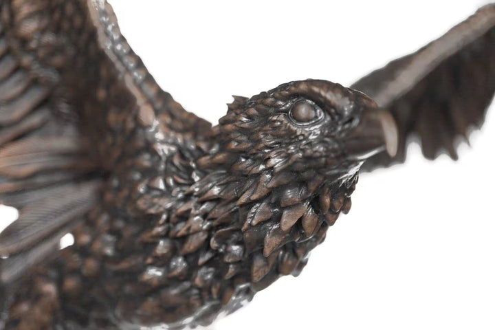 Close-up of a bronze eagle sculpture on a white background, Sky Bound by Dean Kendrick