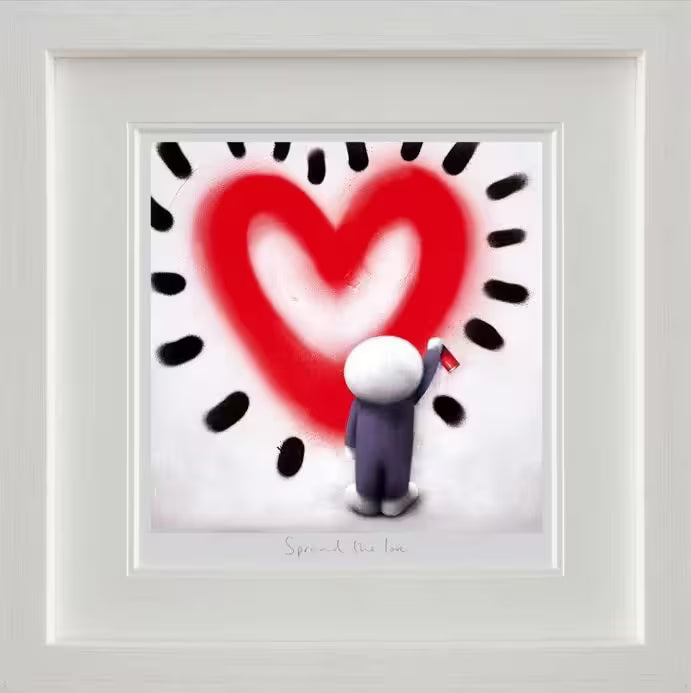 A Doug Hyde framed limited edition print of a person in purple spray painting a red heart with black lines all around onto a white wall, the title is Spread the Love