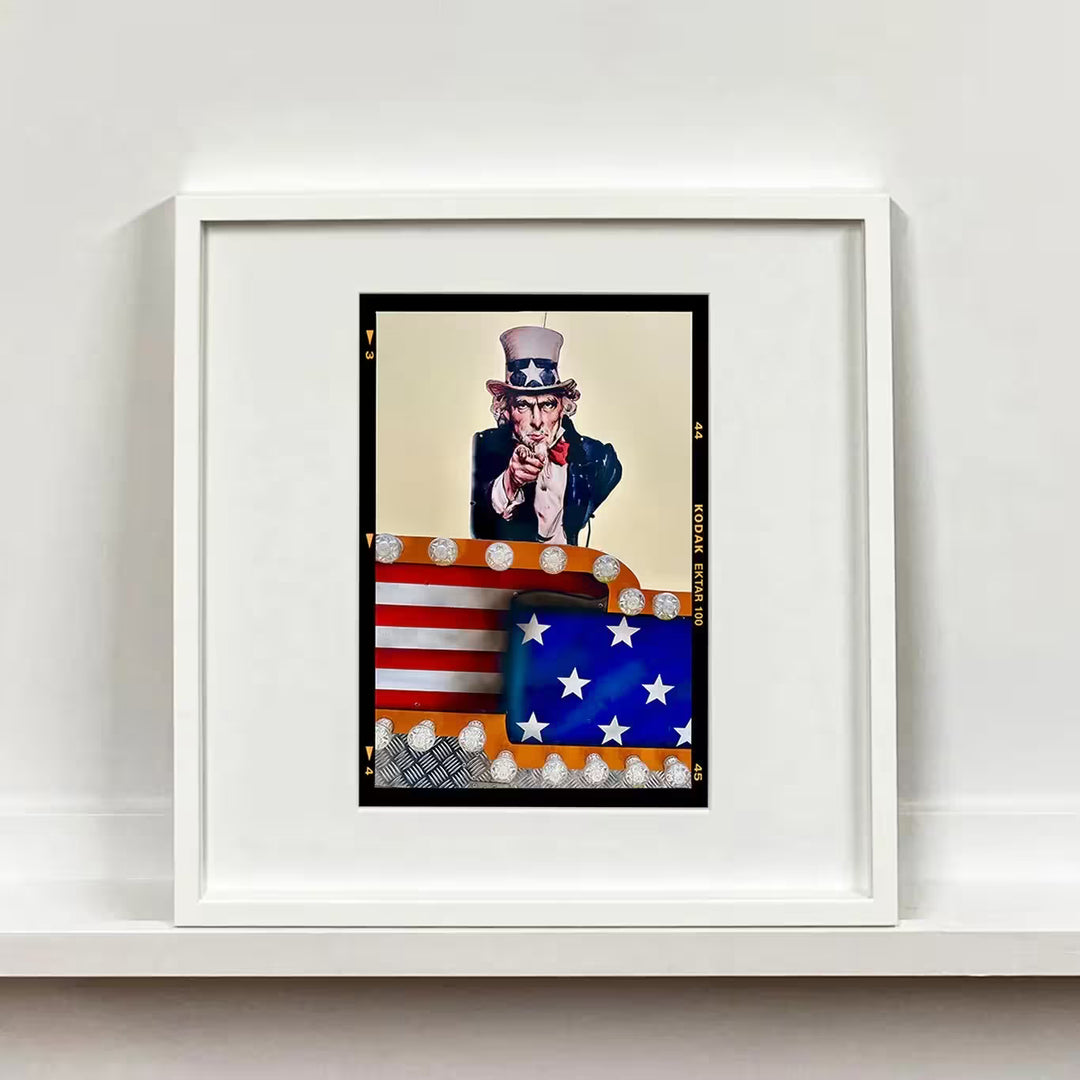 A white framed limited edition photograph by Richard Heeps using vibrant colours, the title is Stars &amp; Stripes Sam