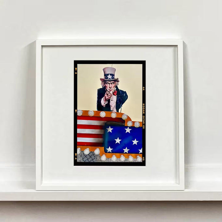 A white framed limited edition photograph by Richard Heeps using vibrant colours, the title is Stars &amp; Stripes Sam