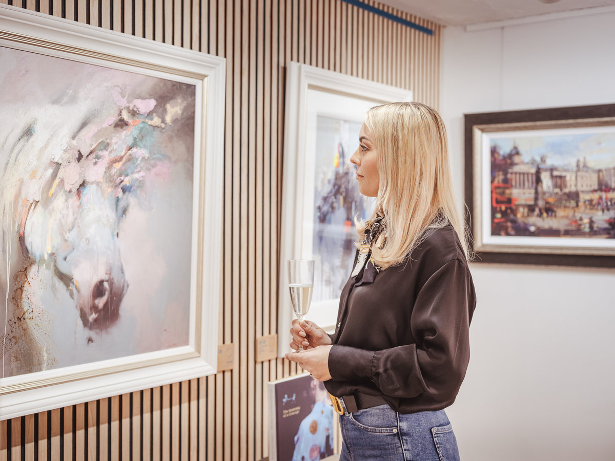 Art and visitors inside a Startle gallery