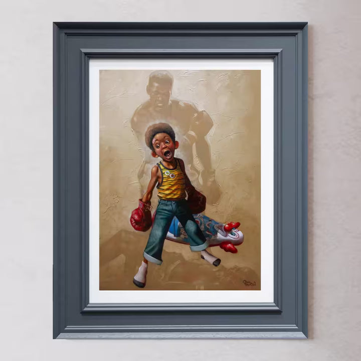 A Craig Davison limited edition of a young boy with boxing gloves on and has knocked down a n inflatable clown, the title is Sting Like a Bee