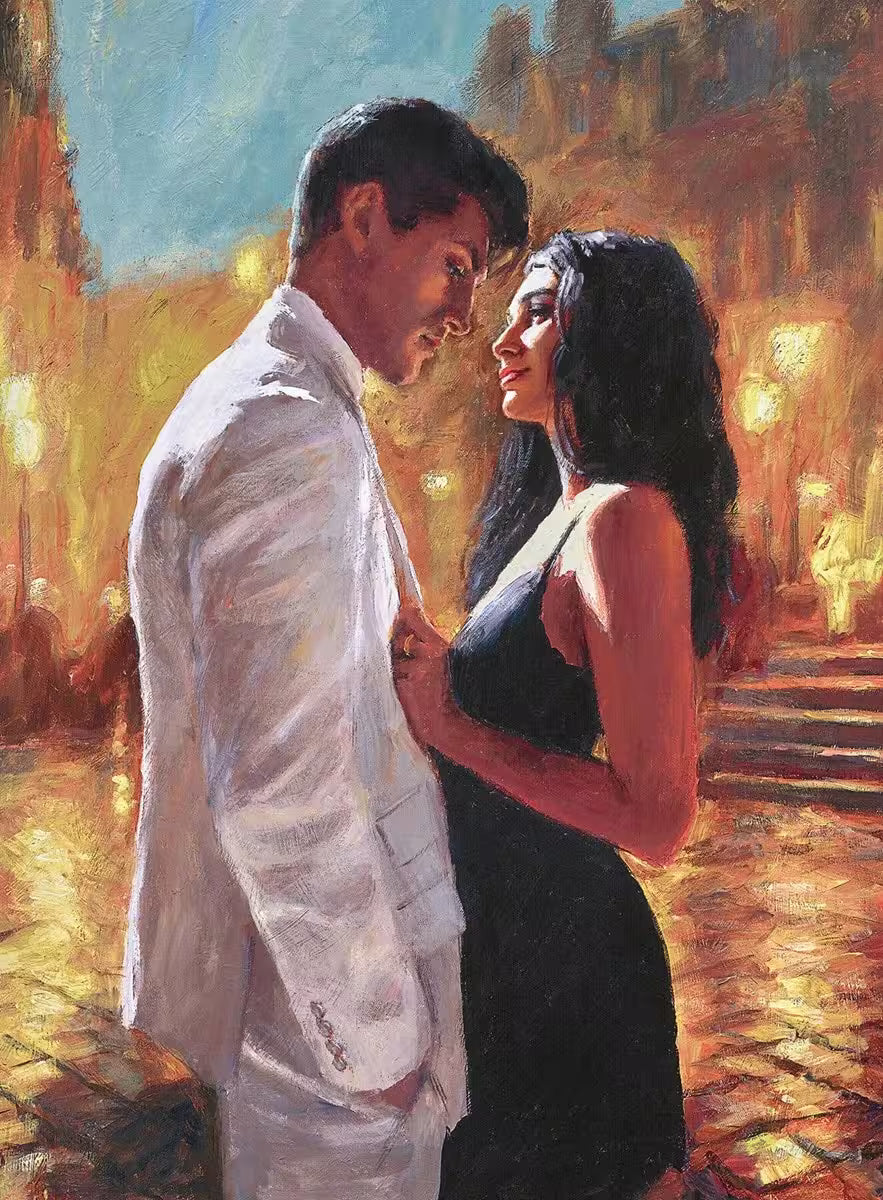 A Fabian Perez limited edition of a man in a white suit and lady in a black dress stood in a warmly lit street, the title is Summer Love