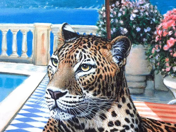 A Steve Tandy limited edition of a leopard laying on a sun bed b a sunny poolside, the title is Summer in Sorrento