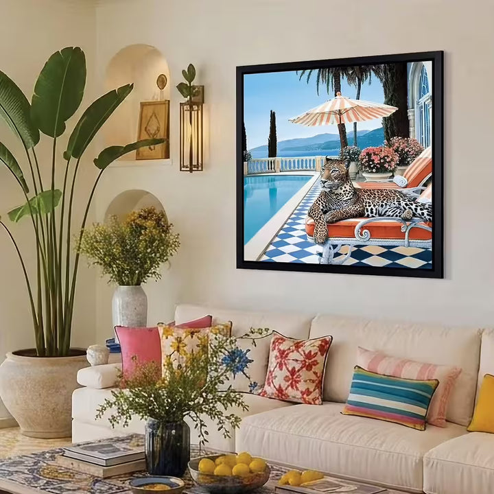 A Steve Tandy limited edition of a leopard laying on a sun bed b a sunny poolside, the title is Summer in Sorrento