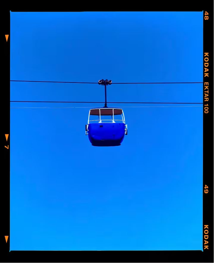 A Richard Heeps limited edition photographic print, the title is Summit Cable Car (Blue), Great Orme, Llandudno, 2023