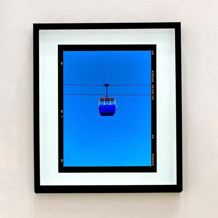 A Richard Heeps limited edition photographic print, the title is Summit Cable Car (Blue), Great Orme, Llandudno, 2023