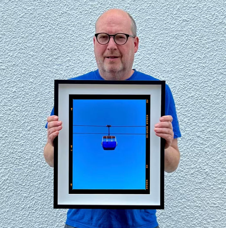 A Richard Heeps limited edition photographic print, the title is Summit Cable Car (Blue), Great Orme, Llandudno, 2023