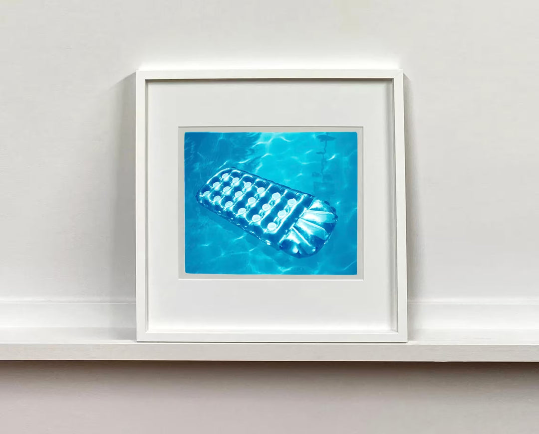 A Richard Heeps white framed limited edition photographic print, the title is Sun Lounger, Ballantines Movie Colony, California, 2002
