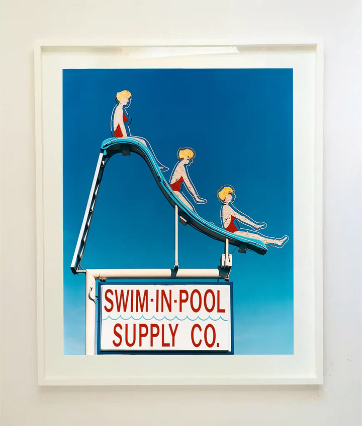 A white framed limited edition photograph by Richard Heeps using vibrant colours, the title is Swim-in-Pool Supply Co. Las Vegas, 2003