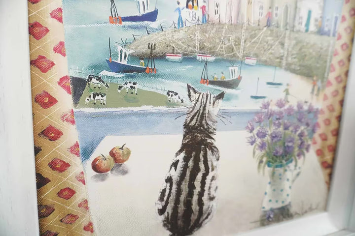 A Rebecca Lardner limited edition of a seaside town with boats, cows and people and a cat sat on a table looking down, the title is Table Manners