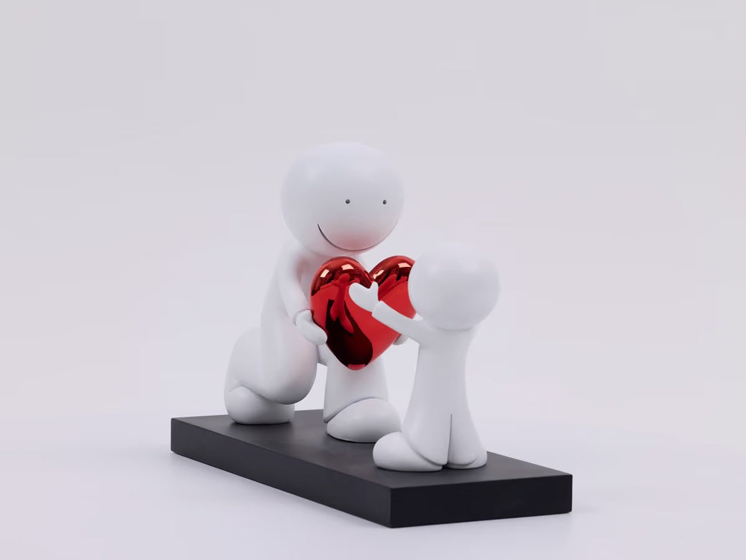 White figures holding a red heart-shaped object on a white background, the Greatest Gift by Doug Hyde