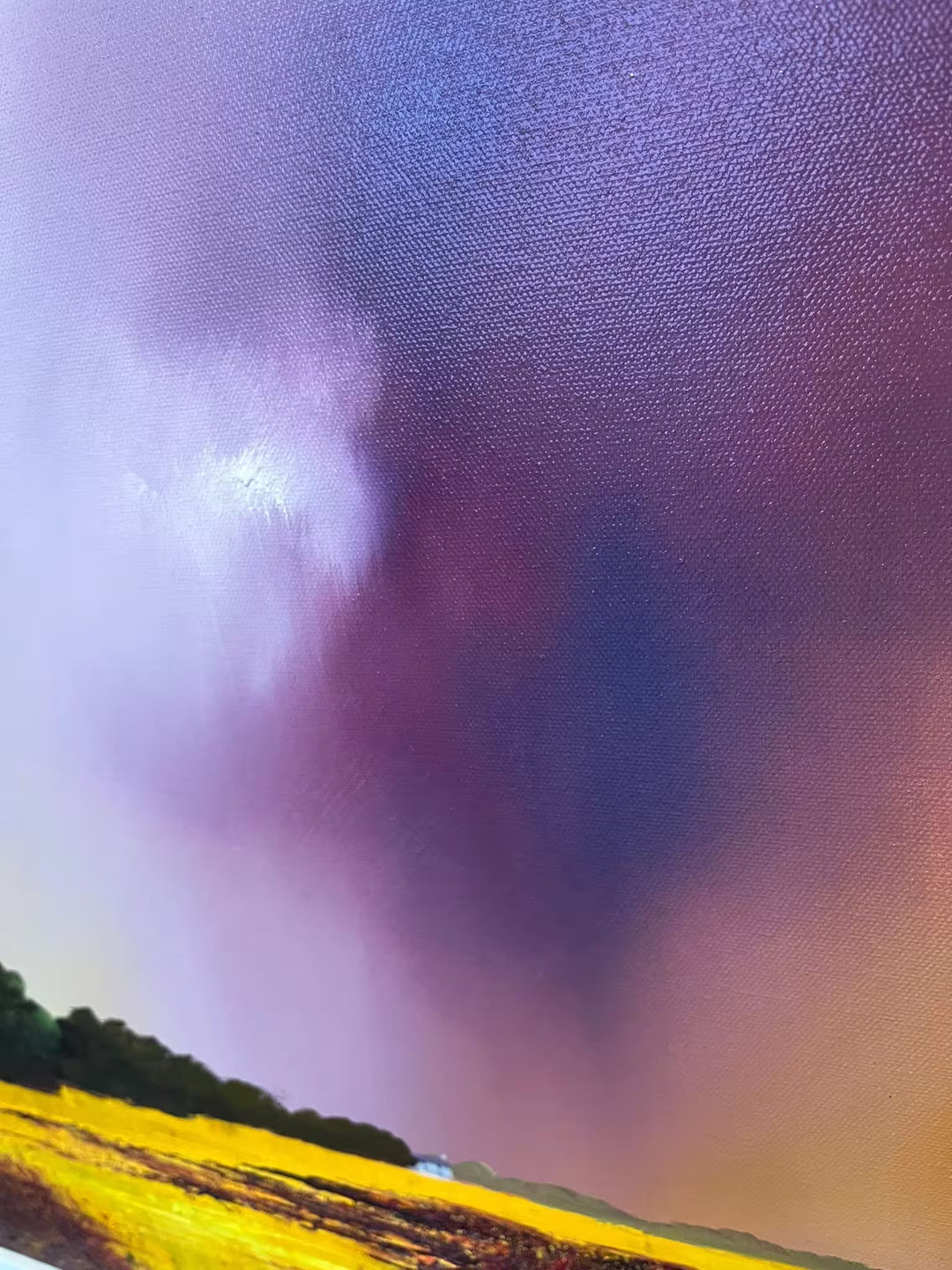 A Barry Hilton original of a yellow field and purple stormy sky, the title is The Keeper of Silence