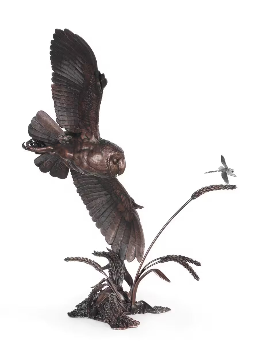 Bronze sculpture of an owl in flight with a dragonfly on a white background, The Watcher by Dean Kendrick