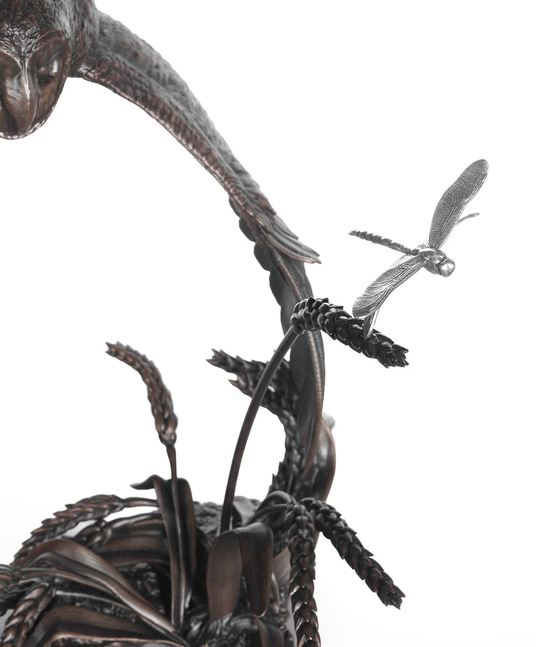 Bronze sculpture of a bird with outstretched wings and a dragonfly on a white background, The Watcher by Dean Kendrick