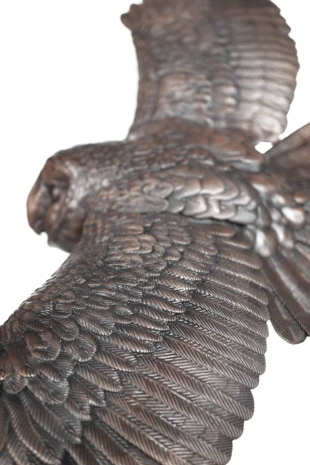 Close-up of a bronze owl sculpture with detailed feathers on a white background, The Watcher by Dean Kendrick