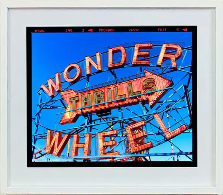 A white framed limited edition photograph by Richard Heeps using vibrant colours, the title is Thrills