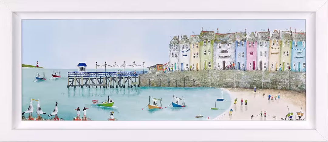 A Rebecca Lardner limited edition piece of a row of colourful houses with a pier at the end and people on the beach and boats on the sea with puffins, seagulls, and avocets on the rocks, the title is Tide and Seek