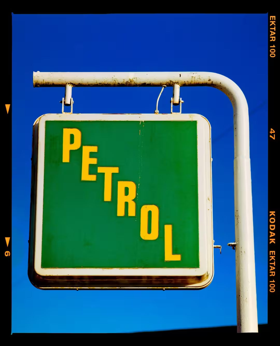 A limited edition photograph by Richard Heeps using vibrant colours, the title is Trevor's Petrol, Binham, Norfolk, 2017