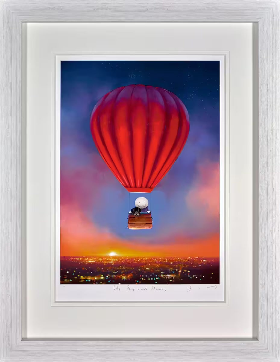 A Doug Hyde framed limited edition of a red hot air below in front of a city skyline at dusk, in the hot air balloon there is a person and a black dog, the title is Up Pup and Away