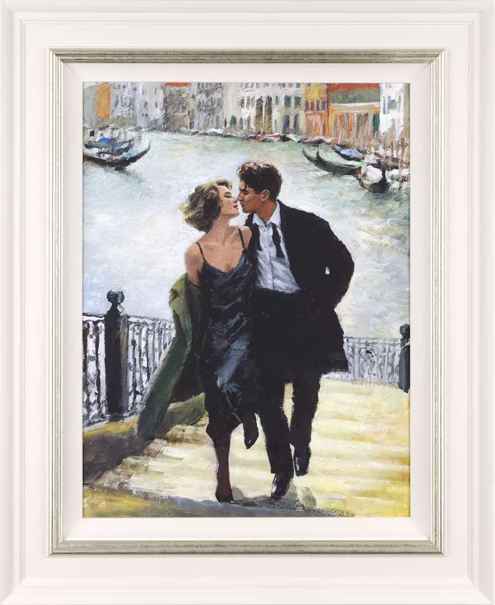 A Fabian Perez framed limited edition piece of t a couple walking up a set of stairs in front of a river, the title is Venetian Romance