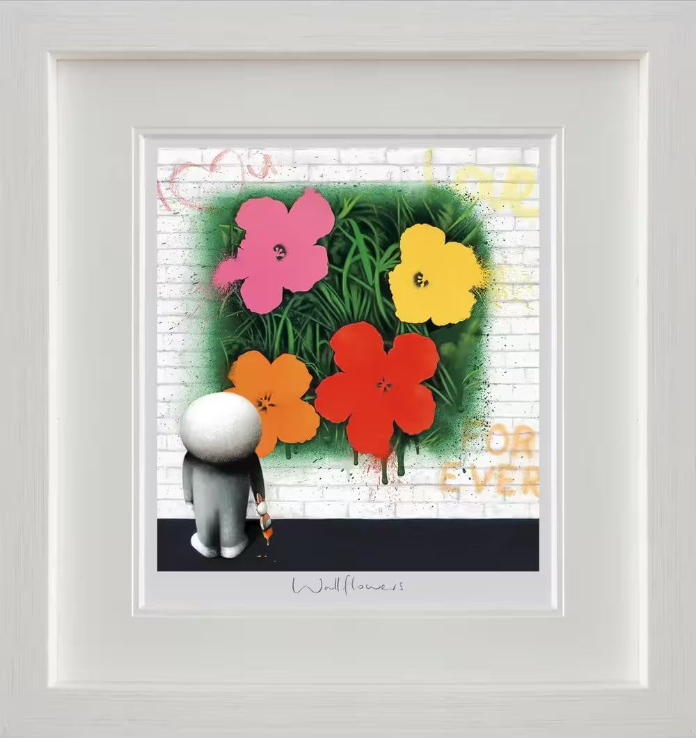 A Doug Hyde framed limited edition of a person painting big flowers on a wall, the title is Wallflowers