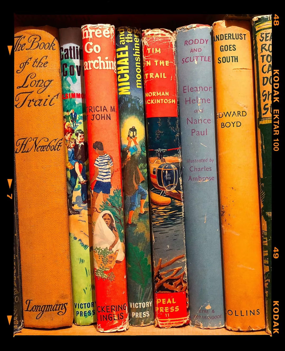 A limited edition photograph by Richard Heeps using vibrant colours, the title is Wanderlust Goes South, Peter's Bookshop, Sheringham, 2018