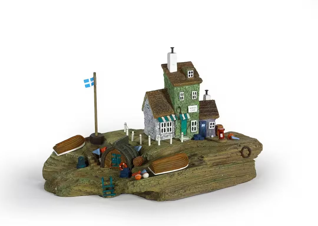 A Rebecca Lardner limited edition sculpture of a small seaside dock with a cafe, the title is Waves Cafe