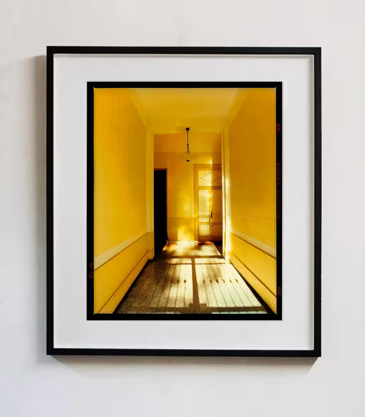 A framed limited edition photograph by Richard Heeps using vibrant colours, the title is Yellow Corridor Day, Milan, 2019