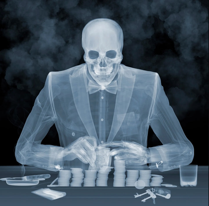 A limited edition Chromaluxe print by Nick Veasey of an X-Rayed black jack player, their skeleton is in thier suit jacket, the title is Black Jack