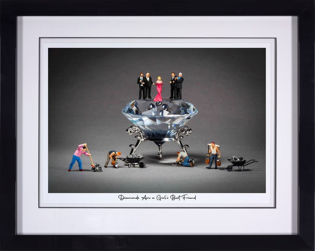 Framed artwork of miniature figures around a large diamond on a gray background. Diamonds Are A Girl&