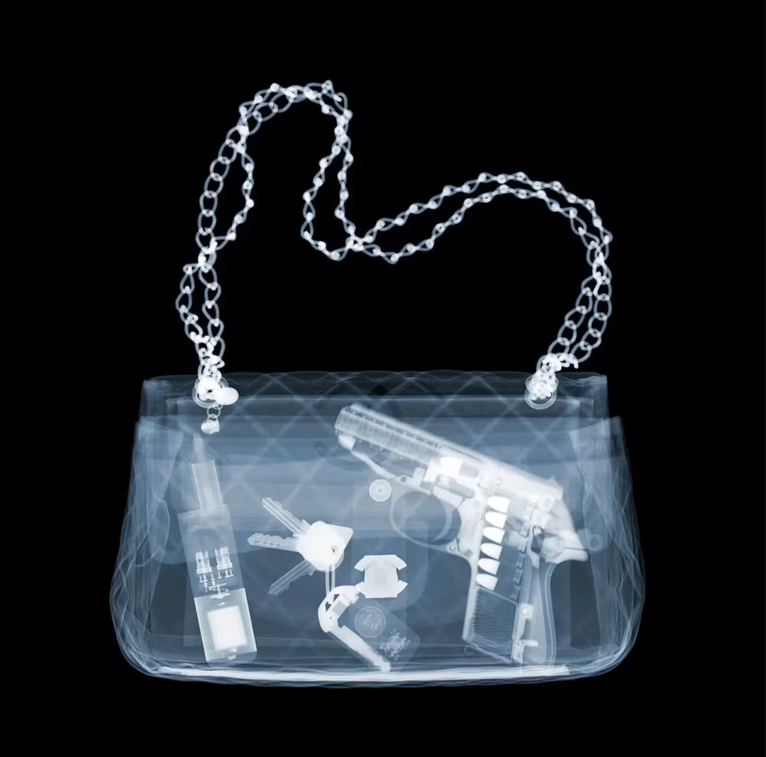A limited edition Chromaluxe print by Nick Veasey of an X-Rayed handbag with a handgun and keys inside, the title is Don&