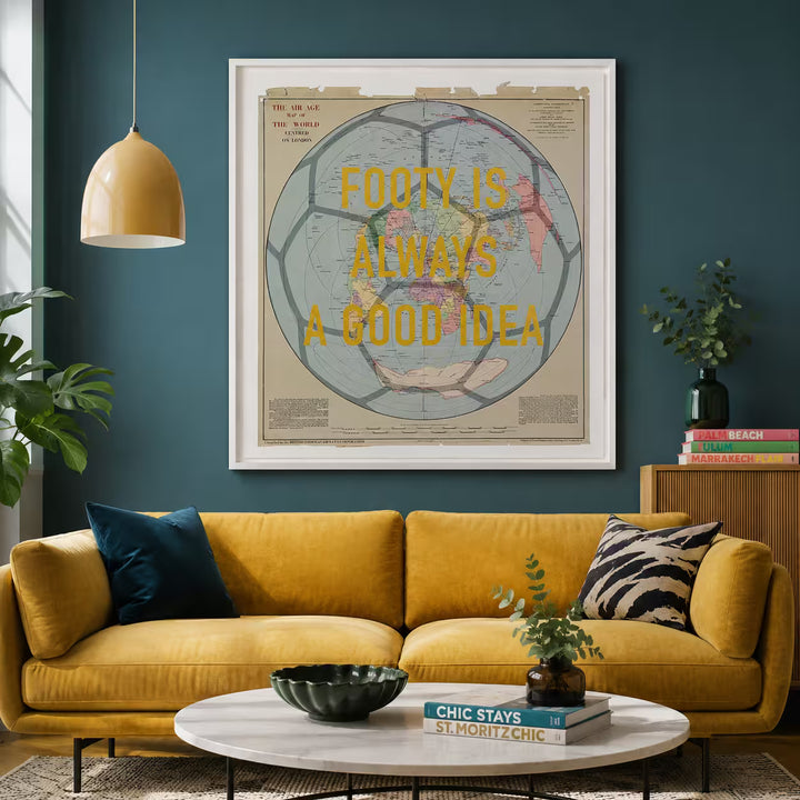 Living room with yellow sofa, coffee table, and framed map art on the wall.