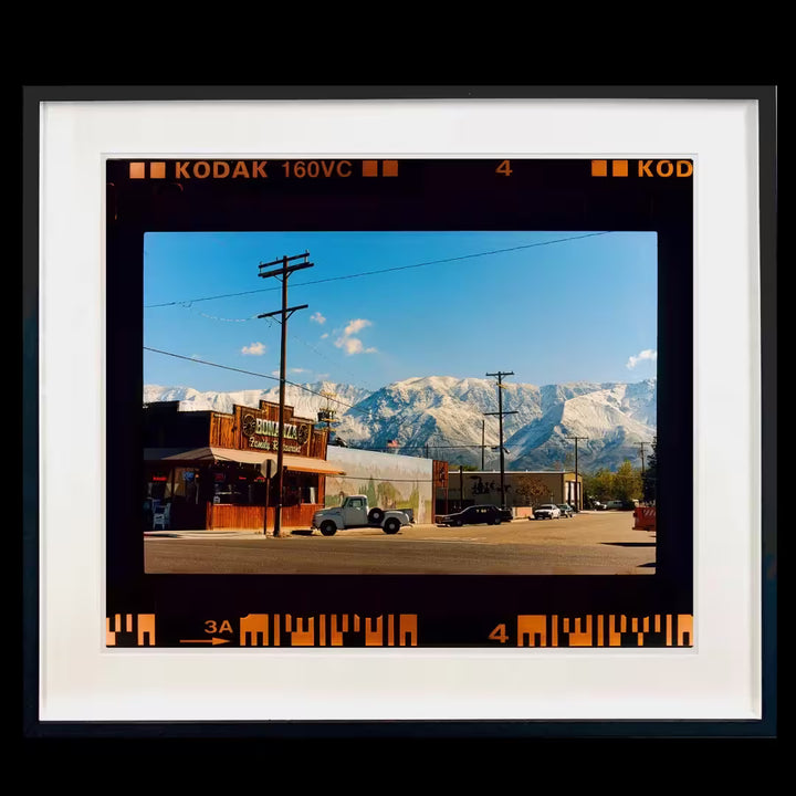 A framed limited edition photograph by Richard Heeps using vibrant colours, the title is On the Road Lone Pine, California, 2000