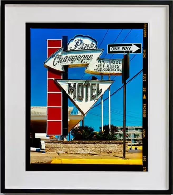 A framed limited edition photograph by Richard Heeps using vibrant colours, the title is Pink Champagne Motel (Film Rebate), Wildwood Jersey, 2013
