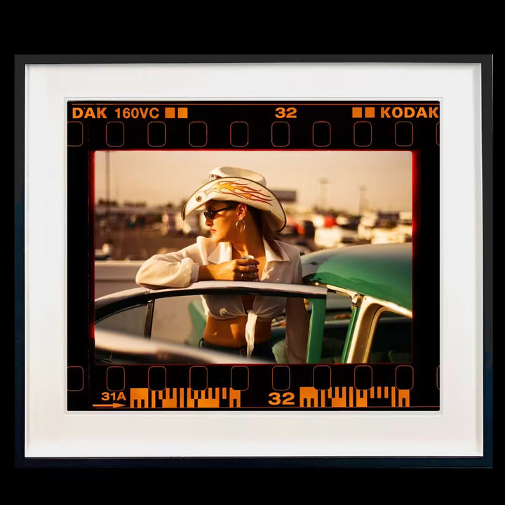 A framed limited edition photograph by Richard Heeps using vibrant colours, the title is On the Road Sunkissed Wendy, Las Vegas, 2001